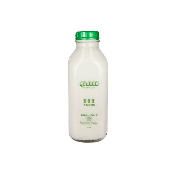 Bottle with a green cap and label on a white background