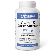 A white bottle of Preferred Nutrition Vitamin C Calcium Ascorbate 1000 mg capsules, shown on a dark green background with a black shadow underneath.