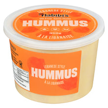 Container of Habibis hummus with orange label on a white background