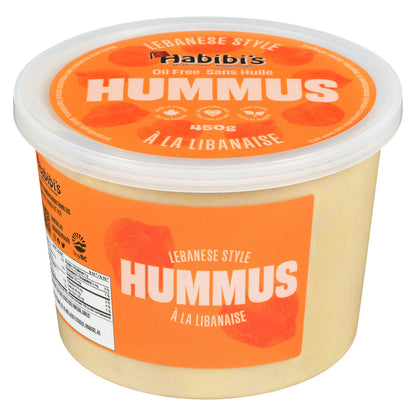 Container of Habibis hummus with orange label on a white background