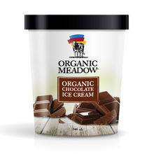 A 946 mL tub of Organic Meadow Organic Chocolate Ice Cream with a black lid and white label, featuring a cow logo and chocolate pieces on a light background.