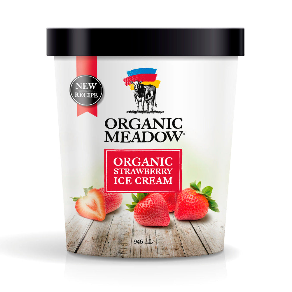 A 946 mL tub of Organic Meadow Organic Strawberry Ice Cream with a black lid and white label, featuring a red ribbon, black logo, and fresh strawberry illustrations on a light gray background.