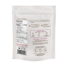 White packaging with text and barcodes on a sandy background