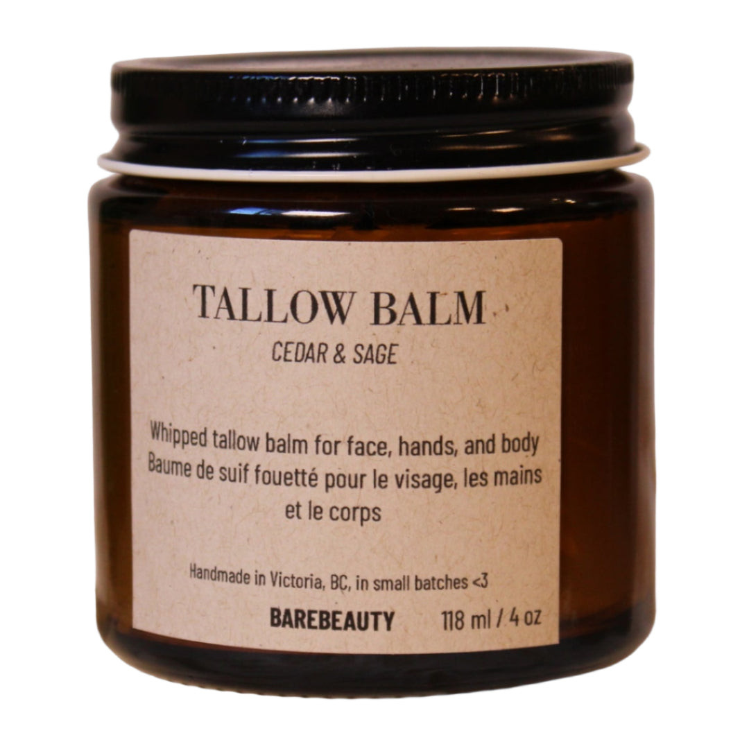 Tallow balm jar with label on a wooden block against a beige background
