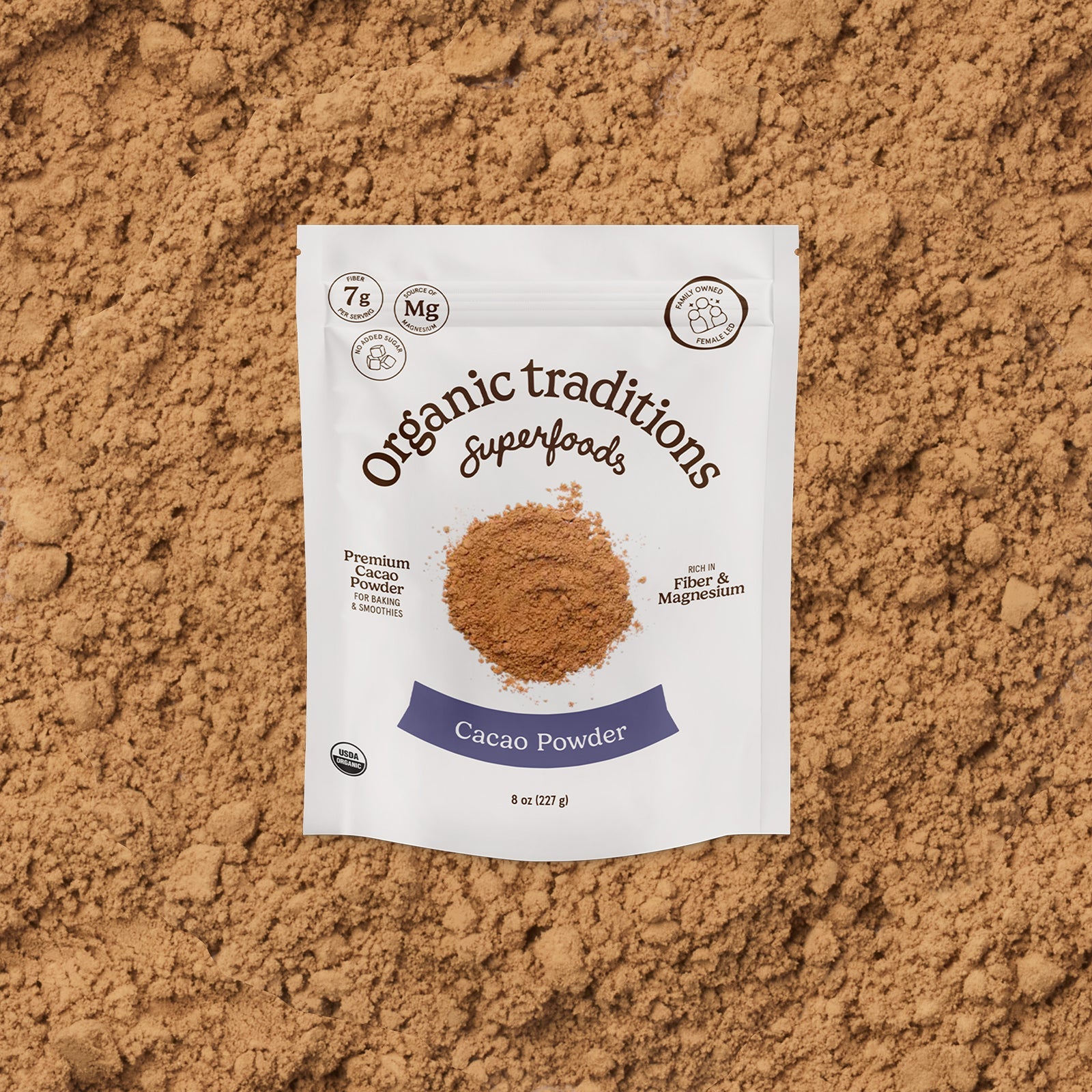 Package of Organic Traditions Cacao Powder on a brown background