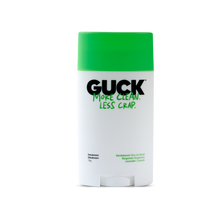 A GUCK brand deodorant stick with a bright green cap and a white body, featuring the text 'MORE CLEAN. LESS CRAP.