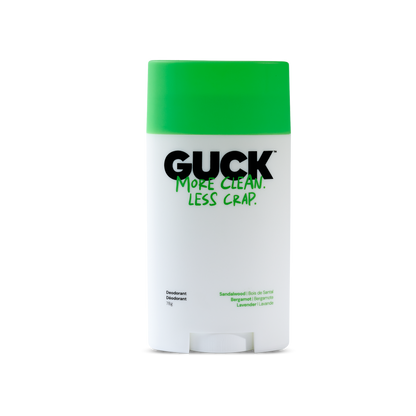 A GUCK brand deodorant stick with a bright green cap and a white body, featuring the text 'MORE CLEAN. LESS CRAP.