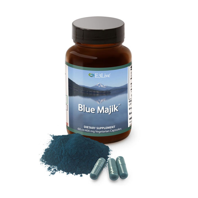 Supplement bottle labeled 'Blue Majik' with powder and capsules on a white background