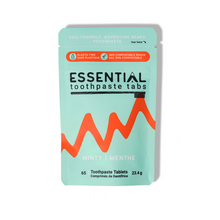 Packaging of Essential toothpaste tabs with a mint green background and red design.