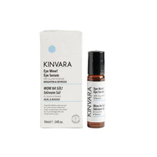 KINVARA Wow! Wow! Eye Serum in a 10ml amber glass bottle with a black cap, standing next to its white cardboard packaging box on a clean white background.