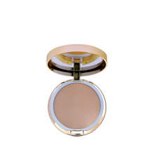 Compact powder in a round, gold-framed case on a white background