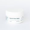 Jar of hand and heel salve on a white background