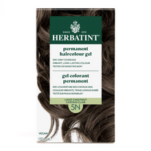 Herbatint permanent haircolour gel packaging with brown hair strands on a white background