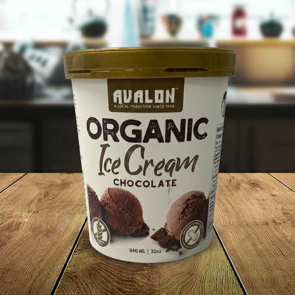Avalon Organic Chocolate Ice Cream container on a wooden surface with a blurred background