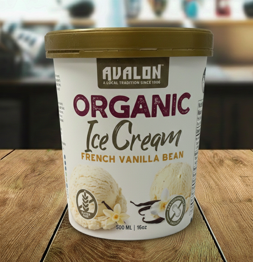 Avalon Organic Ice Cream container with French Vanilla Bean flavor on a wooden surface.