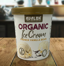 Avalon Organic Ice Cream container with French Vanilla Bean flavor on a wooden surface.