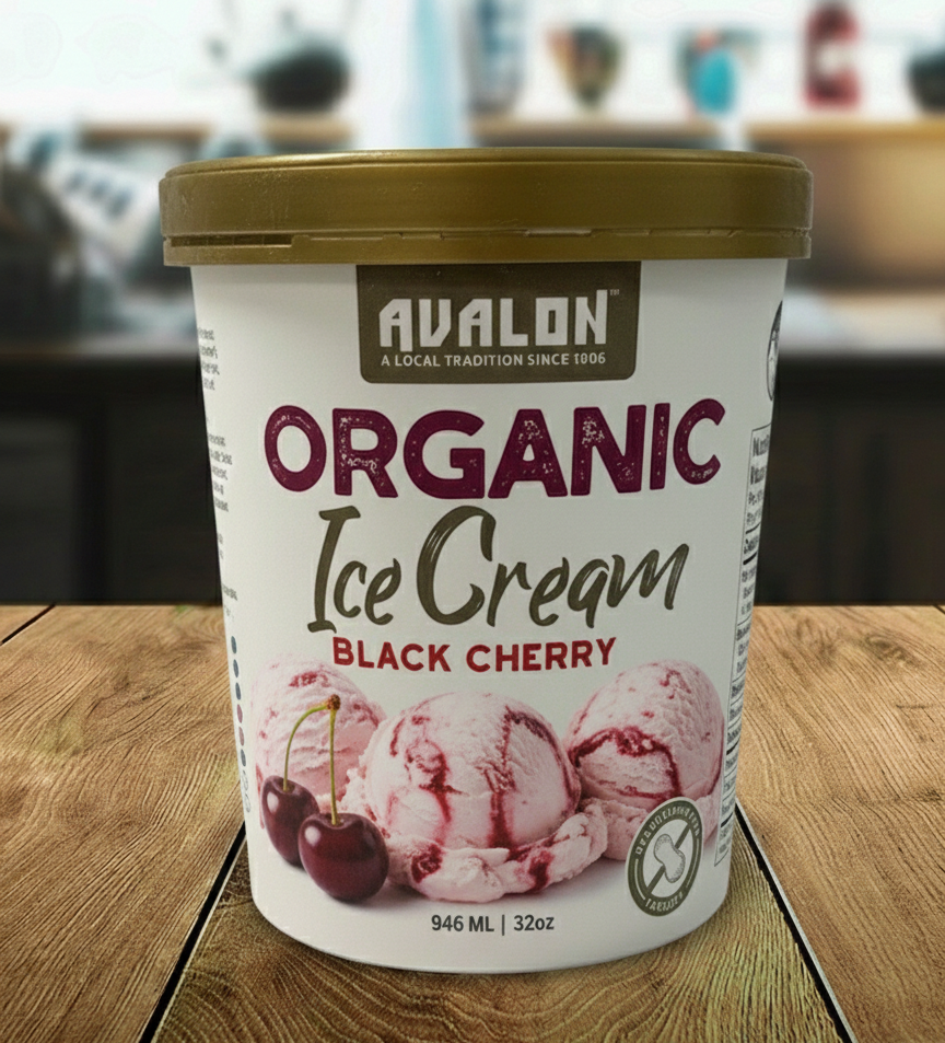 Avalon Organic Black Cherry ice cream container on a wooden surface