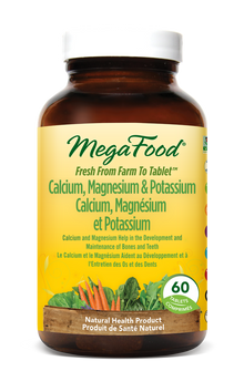 MegaFood supplement bottle with yellow label on a white background
