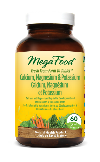 MegaFood supplement bottle with yellow label on a white background
