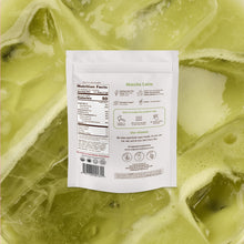 Matcha latte powder package with nutrition facts label on a green and white swirled background