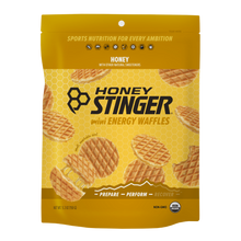 Honey Stinger mini energy waffles packaging on a green background