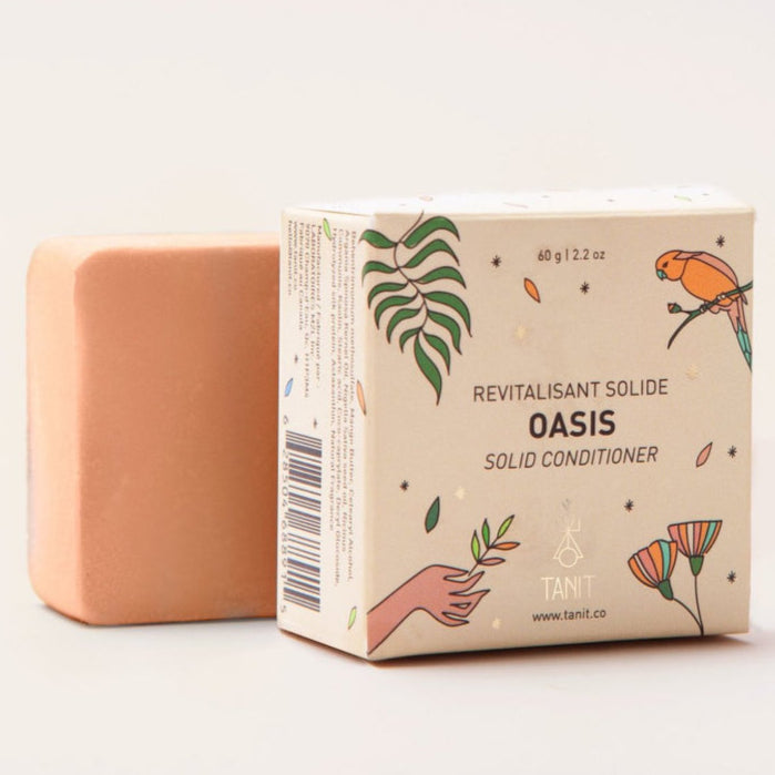 Solid conditioner bar and its packaging with 'Oasis' branding on a light background