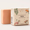 Solid conditioner bar and its packaging with 'Oasis' branding on a light background