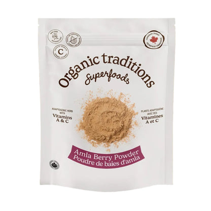 Package of Organic Traditions Amla Berry Powder on a sandy background