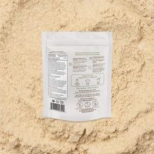 White product packaging label on a beige sand-like textured background