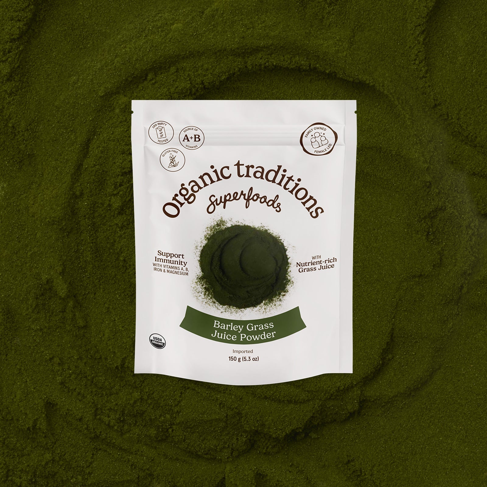 Package of Organic Traditions Barley Grass Juice Powder on a green background