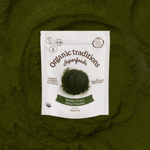 Package of Organic Traditions Barley Grass Juice Powder on a green background