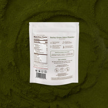Barley grass juice powder package with nutrition facts label on a green background