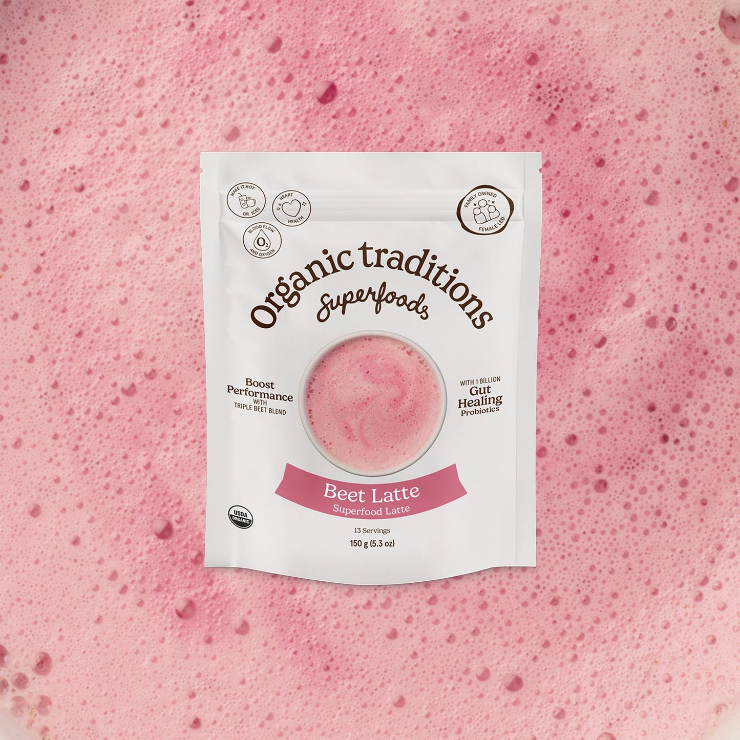 Package of Organic Traditions Beet Latte on a pink background