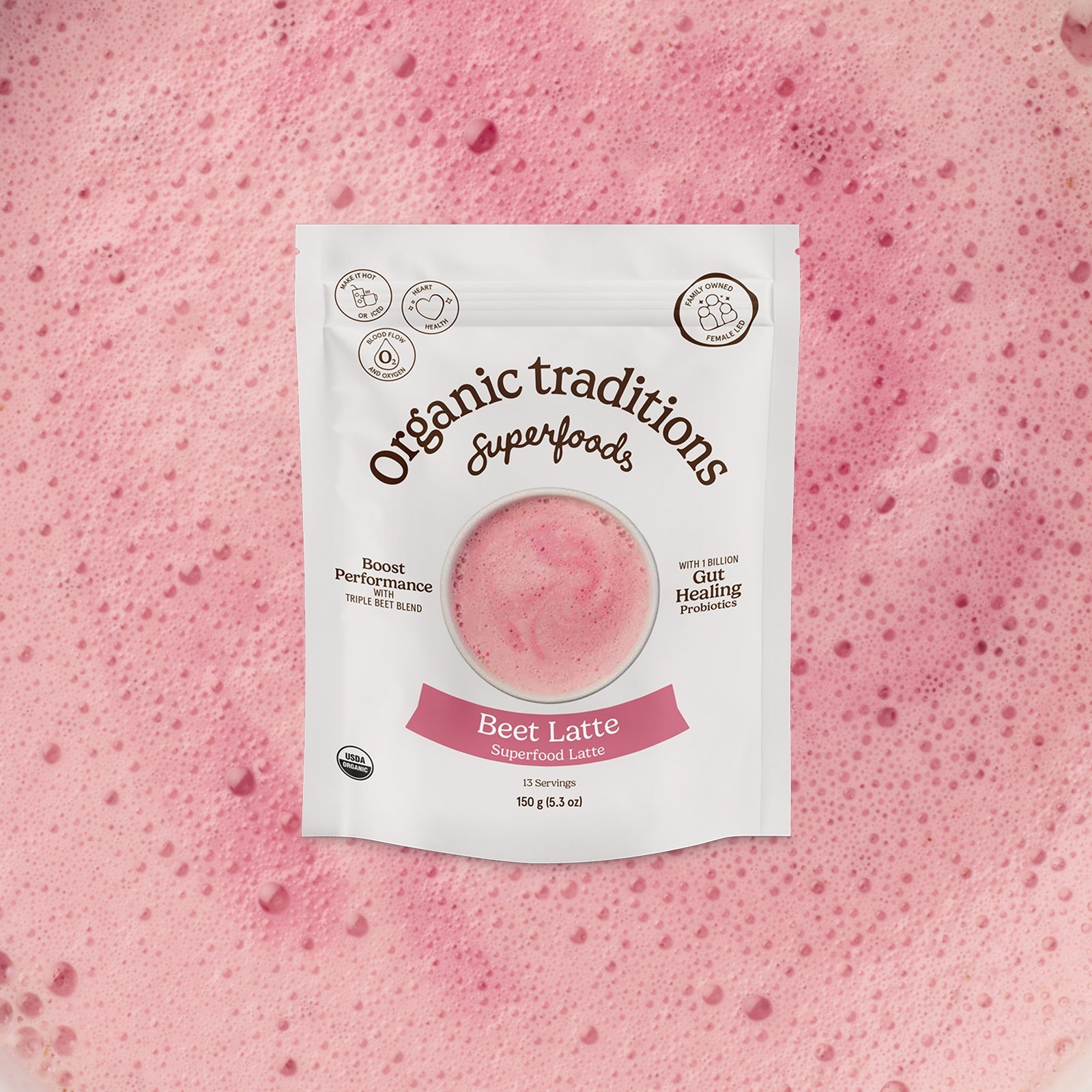 Package of Organic Traditions Beet Latte on a pink background