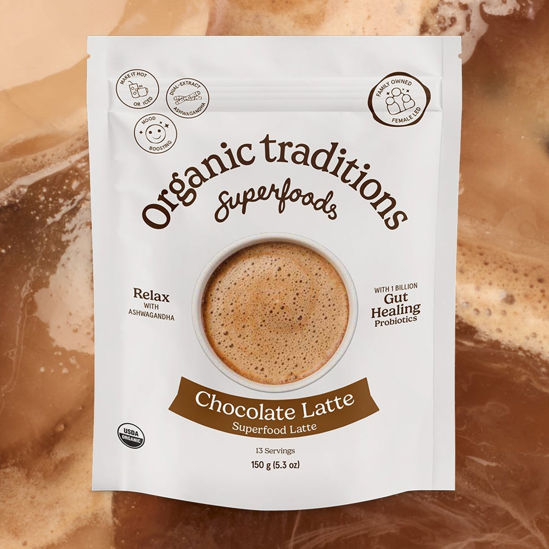 Organic traditions superfoods chocolate latte package on a swirling chocolate background