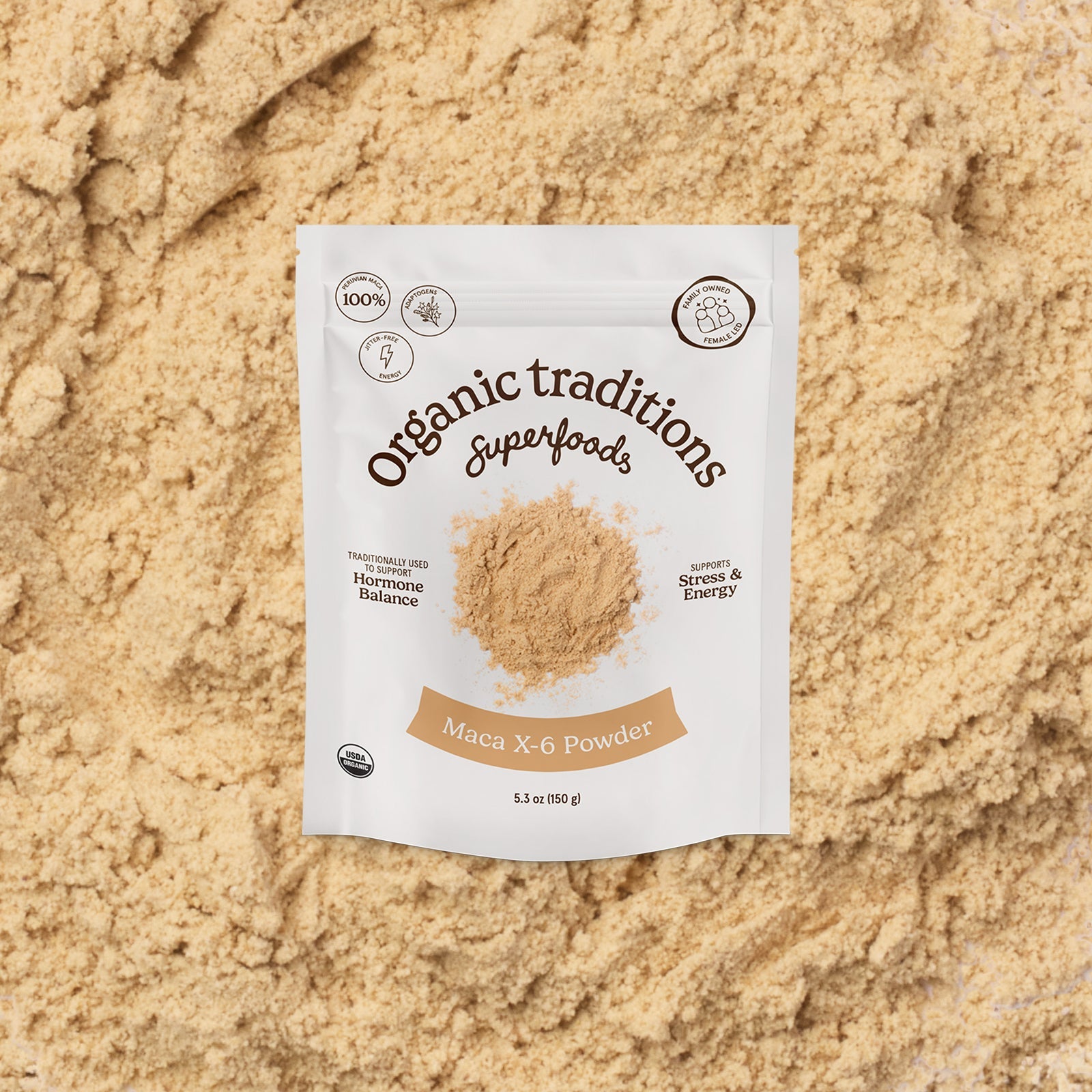 Package of Organic Traditions Superfoods Maca X-6 Powder on a sandy background