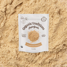 Package of Organic Traditions Superfoods Maca X-6 Powder on a sandy background