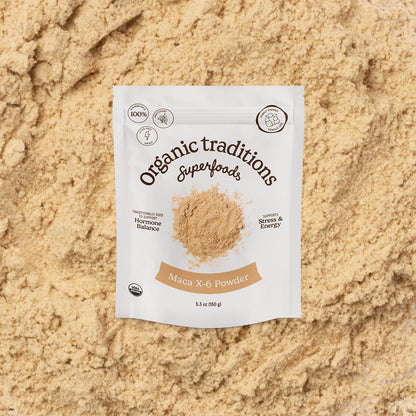 Package of Organic Traditions Superfoods Maca X-6 Powder on a sandy background