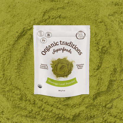 Package of Organic Traditions Moringa Leaf Powder on a green background