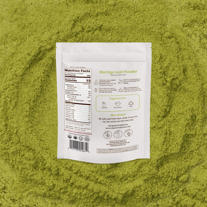 Moringa leaf powder packaging on a green powder background