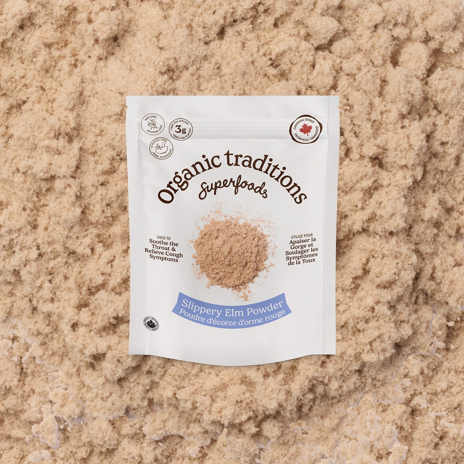 Package of Organic Traditions Slippery Elm Powder on a textured beige background
