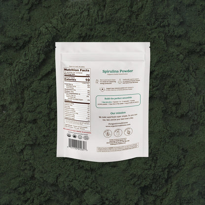 Spirulina powder package on a green textured background