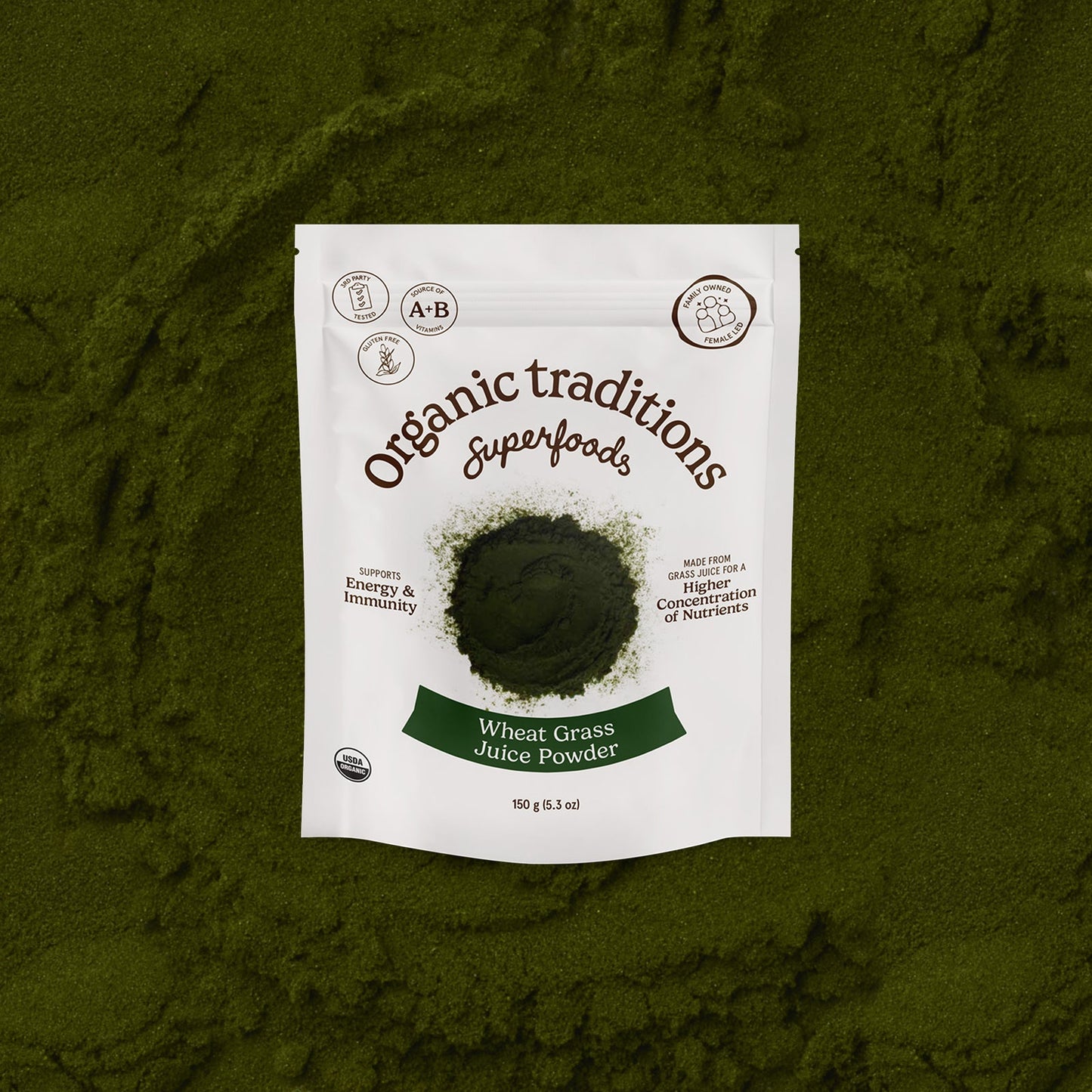 Package of Organic Traditions Wheat Grass Juice Powder on a green background