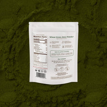 Wheat grass juice powder package on a green textured background
