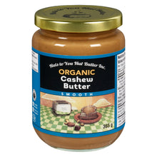 Jar of organic cashew butter with a gold lid on a white background