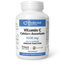 A white bottle of Preferred Nutrition Vitamin C Calcium Ascorbate 1000 mg dietary supplement, displayed on a black surface against a solid green background.
