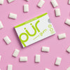 Box of PUR gum with white pieces on a pink background