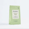 Green tea detox package by Voesh on a white background
