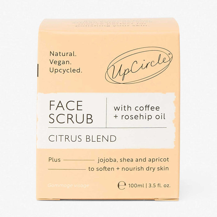 UpCircle Face Scrub packaging with citrus blend on a light gray background