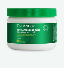 Jar of Organika activated charcoal on a white background